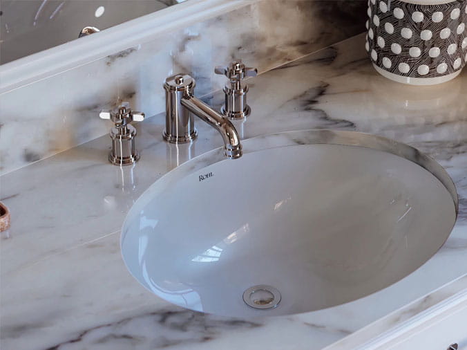 Rohl bathroom sink with polished chrome faucet