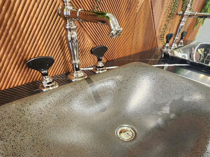stone sink basin with chrome faucet